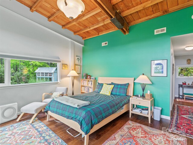 319 Twilight Way, Burnsville, NC 28714 - bedroom with wood ceiling, beam ceiling, wood finished floors, and baseboards