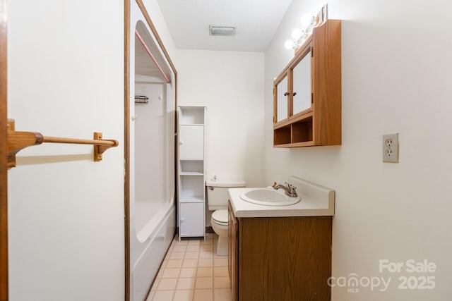 full bathroom with toilet and vanity