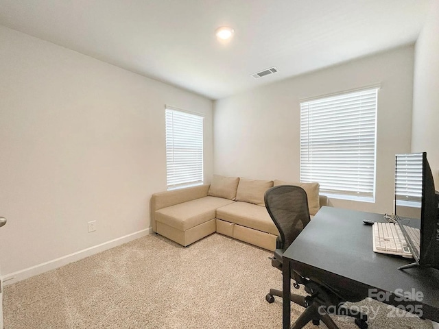 carpeted office with baseboards