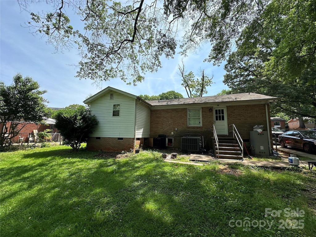 3720 Blandwood Dr, Charlotte, NC 28217 - rear view of property with crawl space, a lawn, cooling unit, and brick siding