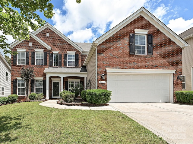 view of front facade with brick siding, concrete driveway, a front yard, and a garage