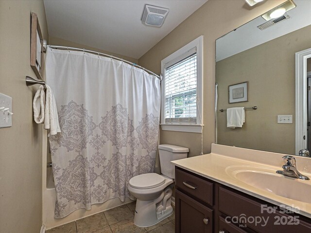 full bath with toilet, vanity, tile patterned flooring, and shower / bath combination with curtain