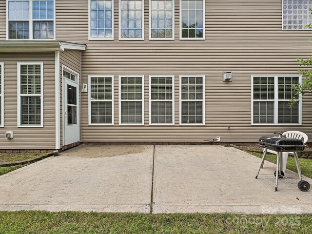 rear view of house featuring a patio area