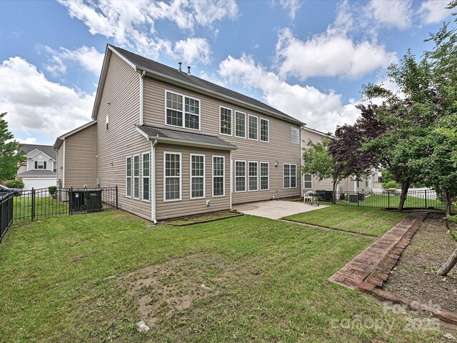 back of property with a patio and central AC unit