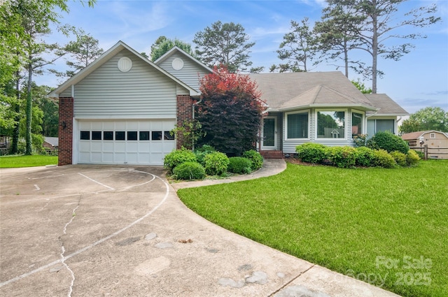 104 Gallarie Pl, Salisbury, NC 28144 - view of front of home with driveway, a garage, a front lawn, and brick siding