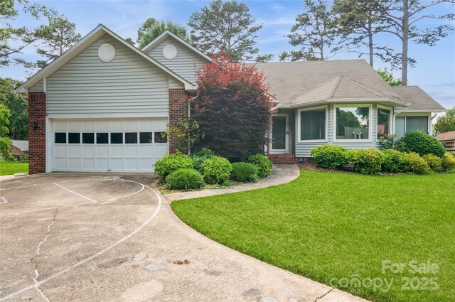104 Gallarie Pl, Salisbury, NC 28144 - ranch-style house with driveway, a front yard, an attached garage, and brick siding
