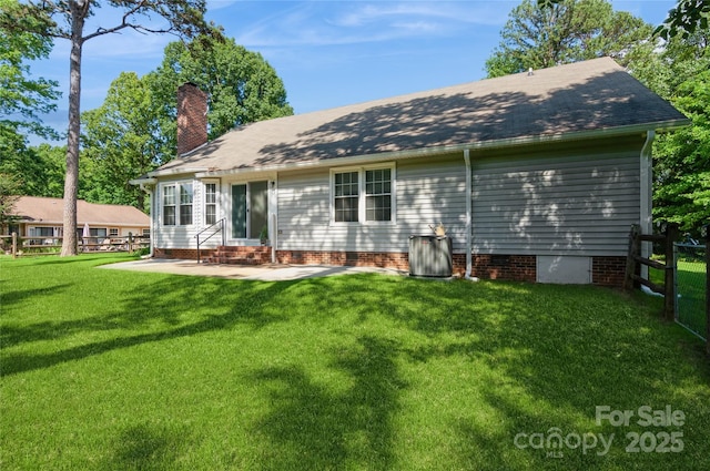 104 Gallarie Pl, Salisbury, NC 28144 - back of house with entry steps, a chimney, and a patio area