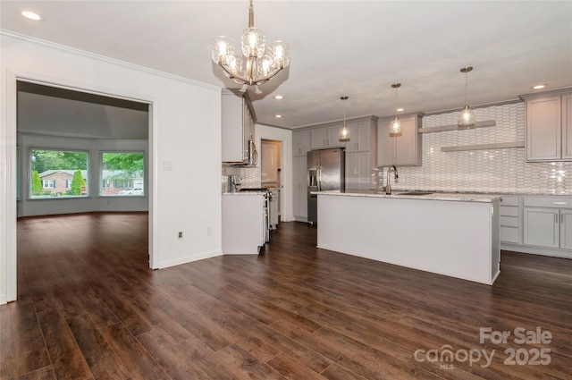 104 Gallarie Pl, Salisbury, NC 28144 - kitchen featuring stainless steel appliances, crown molding, decorative backsplash, gray cabinets, and an island with sink