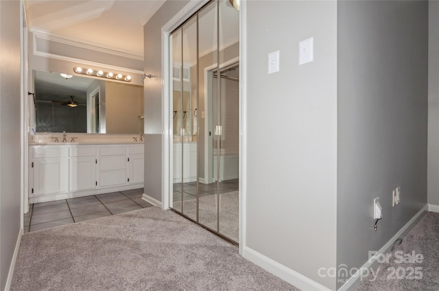104 Gallarie Pl, Salisbury, NC 28144 - bathroom with ornamental molding, double vanity, baseboards, tile patterned floors, and carpet