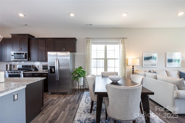 9521 Ainslie Downs St, Charlotte, NC 28273 - dining area with dark wood-type flooring and recessed lighting