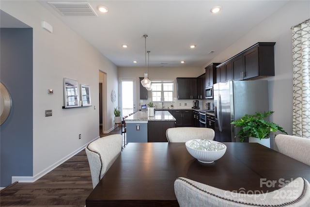 9521 Ainslie Downs St, Charlotte, NC 28273 - dining area with dark wood-type flooring, recessed lighting, and baseboards