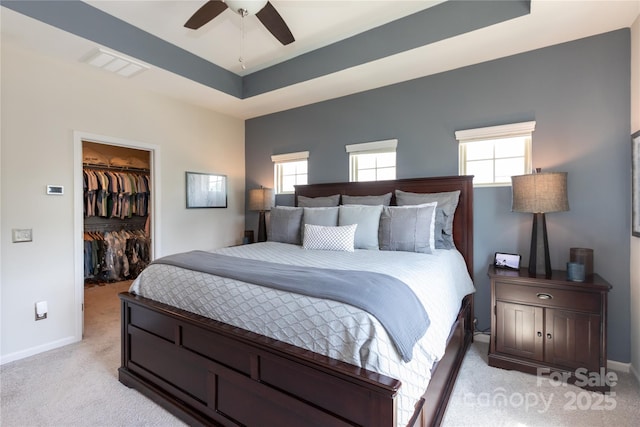 9521 Ainslie Downs St, Charlotte, NC 28273 - bedroom featuring light colored carpet, a spacious closet, baseboards, a closet, and a raised ceiling