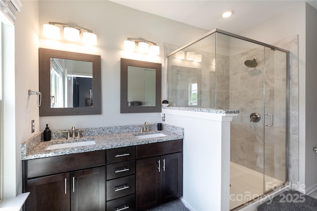 9521 Ainslie Downs St, Charlotte, NC 28273 - bathroom with a shower stall, double vanity, and recessed lighting