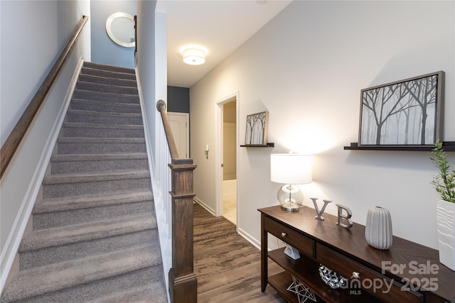 9521 Ainslie Downs St, Charlotte, NC 28273 - staircase with wood finished floors and baseboards