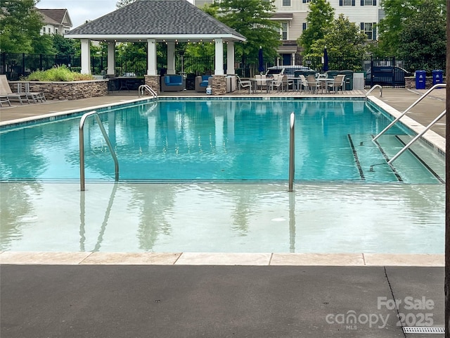 9521 Ainslie Downs St, Charlotte, NC 28273 - community pool featuring a gazebo and a patio area