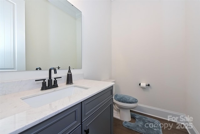 809 Brown Creek Dr, Matthews, NC 28104 - bathroom featuring toilet, wood finished floors, vanity, and baseboards