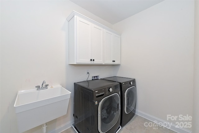 809 Brown Creek Dr, Matthews, NC 28104 - washroom with washing machine and dryer, cabinet space, baseboards, and light tile patterned floors