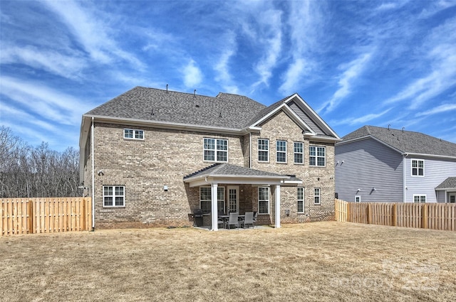809 Brown Creek Dr, Matthews, NC 28104 - rear view of property featuring brick siding, a patio, and a fenced backyard