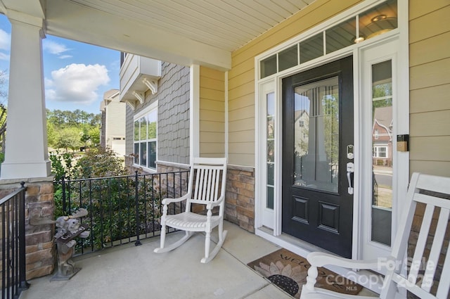 16831 Alydar Commons Ln, Charlotte, NC 28278 - view of exterior entry featuring a porch and stone siding