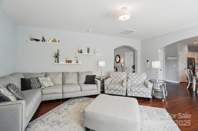 16831 Alydar Commons Ln, Charlotte, NC 28278 - living area with arched walkways and wood finished floors