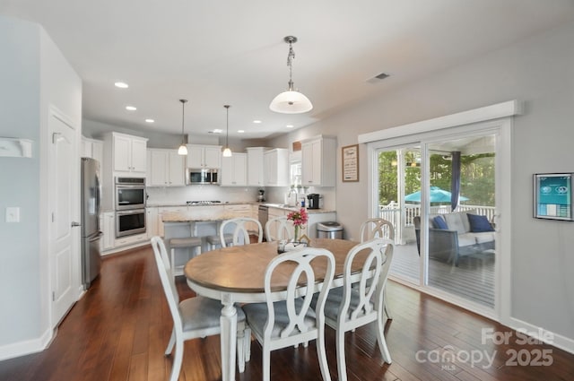 16831 Alydar Commons Ln, Charlotte, NC 28278 - dining area with dark wood-style floors and recessed lighting