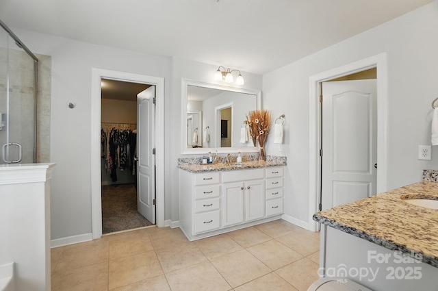 16831 Alydar Commons Ln, Charlotte, NC 28278 - full bath featuring two vanities, a shower stall, and tile patterned floors