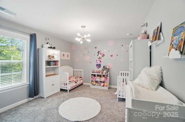 16831 Alydar Commons Ln, Charlotte, NC 28278 - bedroom with carpet, a chandelier, and a crib