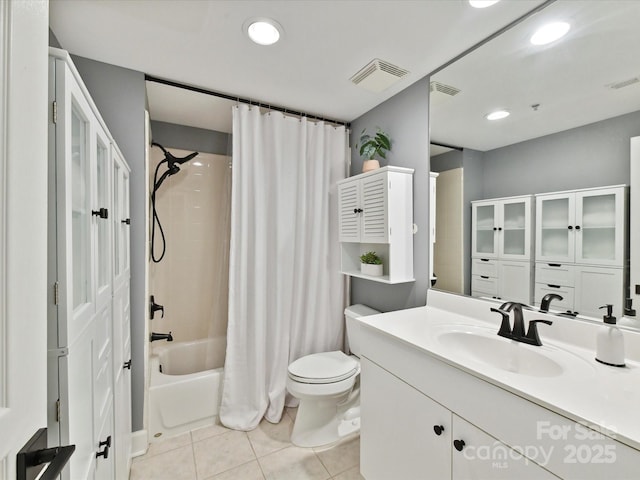 bathroom featuring tile patterned floors, toilet, shower / bath combo, recessed lighting, and vanity