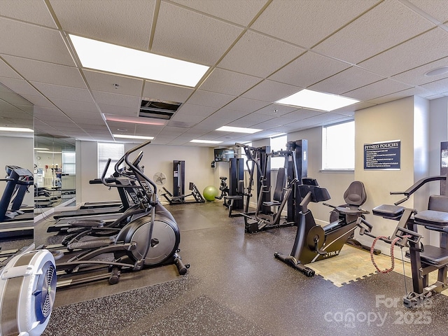 exercise room featuring a drop ceiling