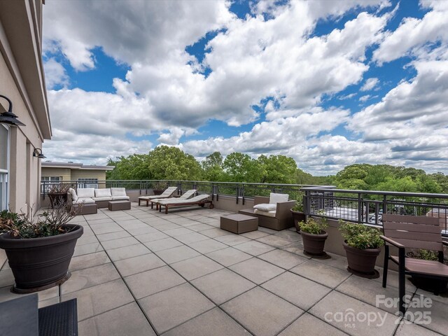 view of patio / terrace with an outdoor hangout area and a balcony