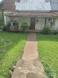 154 N Meridian St, Rutherfordton, NC 28139 - view of exterior entry featuring a yard