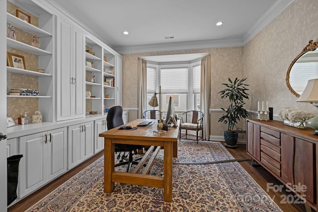 home office featuring wallpapered walls, crown molding, and dark wood-style flooring