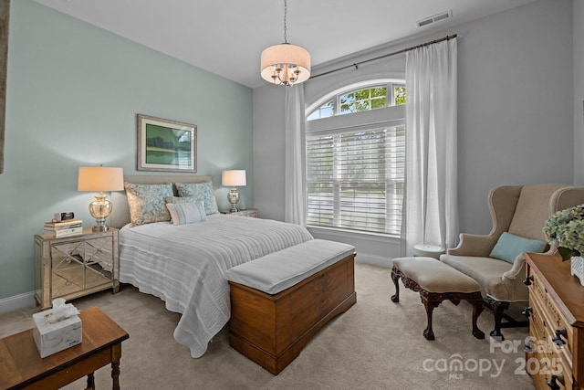 bedroom featuring carpet and baseboards