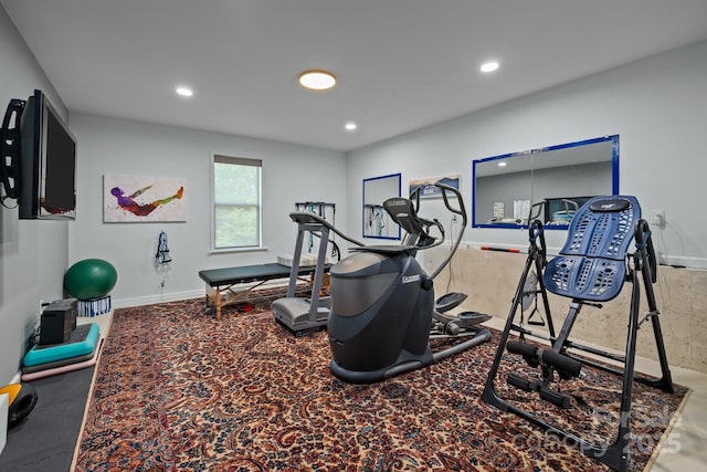 workout room with recessed lighting and baseboards