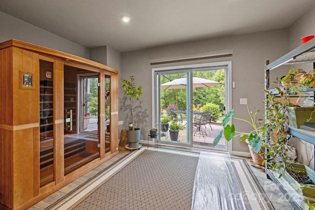 doorway to outside featuring recessed lighting and baseboards