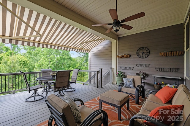 deck with outdoor dining space, an outdoor living space, and ceiling fan