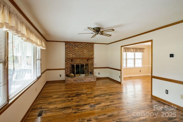 16612 Grapperhall Dr, Huntersville, NC 28078 - unfurnished living room with a ceiling fan, wood finished floors, baseboards, a brick fireplace, and ornamental molding