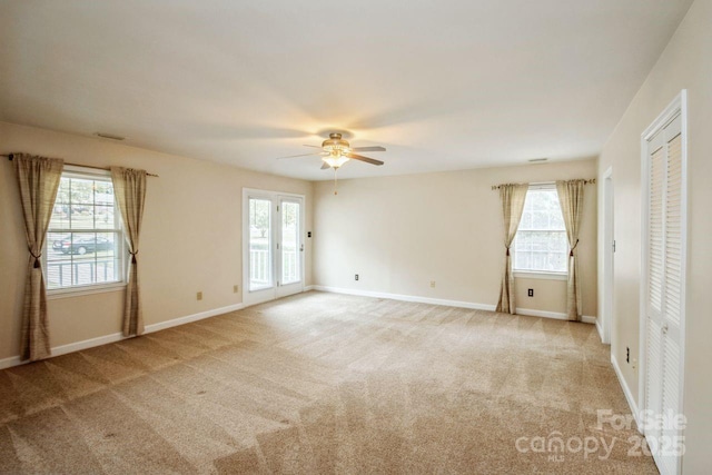 16612 Grapperhall Dr, Huntersville, NC 28078 - unfurnished bedroom with baseboards, multiple windows, and carpet