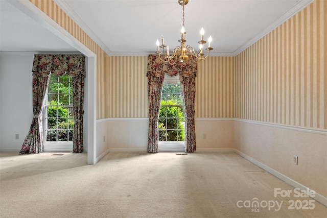 1940 12th St NE, Hickory, NC 28601 - empty room with wallpapered walls, a chandelier, carpet, crown molding, and baseboards