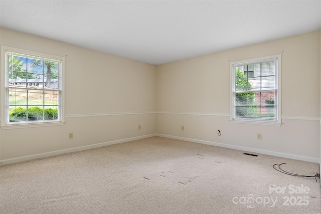 1940 12th St NE, Hickory, NC 28601 - empty room featuring carpet flooring and baseboards