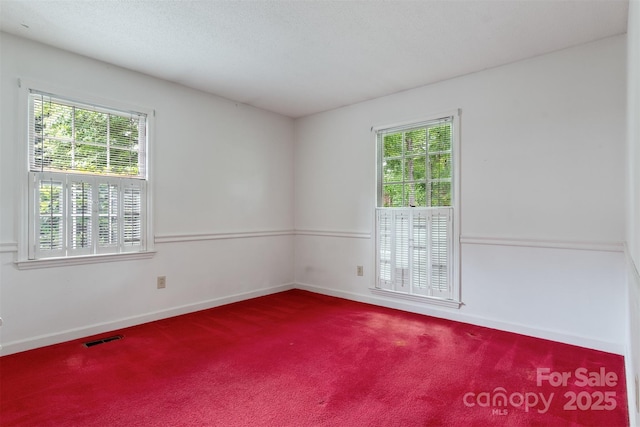 1940 12th St NE, Hickory, NC 28601 - carpeted spare room with plenty of natural light and baseboards