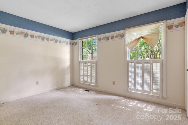 1940 12th St NE, Hickory, NC 28601 - carpeted empty room with baseboards
