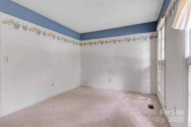 1940 12th St NE, Hickory, NC 28601 - spare room with carpet floors and baseboards