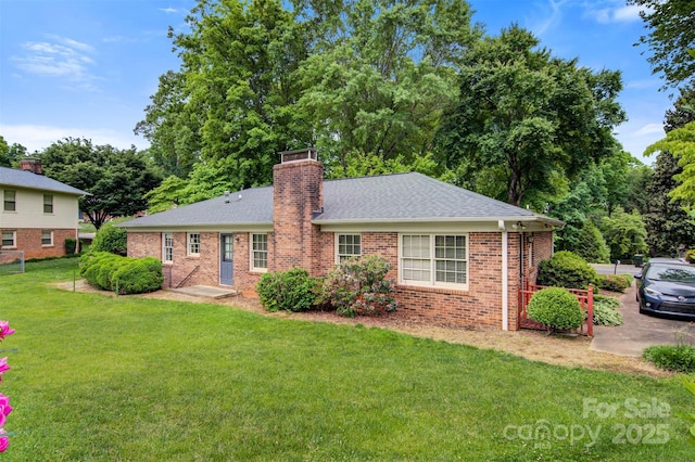 1940 12th St NE, Hickory, NC 28601 - view of front of home with a front lawn, brick siding, a chimney, and a shingled roof