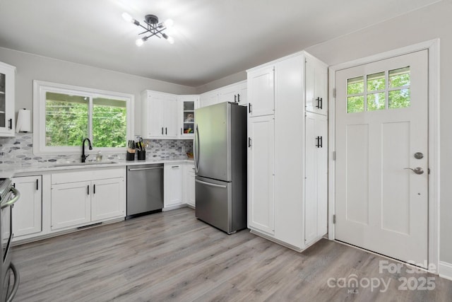 4516 Kiser Island Rd Unit 1, Terrell, NC 28682 - kitchen featuring stainless steel appliances, a sink, healthy amount of natural light, and light wood-style flooring