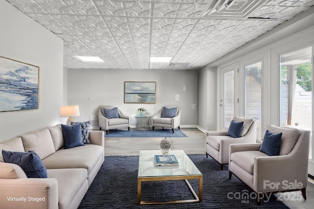 4516 Kiser Island Rd Unit 1, Terrell, NC 28682 - living room featuring wood finished floors, an ornate ceiling, and baseboards