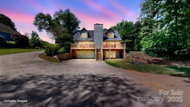 4516 Kiser Island Rd Unit 1, Terrell, NC 28682 - view of front of home featuring an attached garage, driveway, stairs, a chimney, and a wooden deck