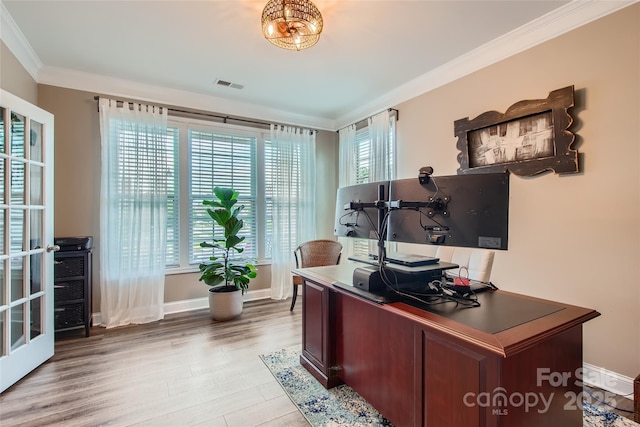 office area with crown molding, wood finished floors, and baseboards