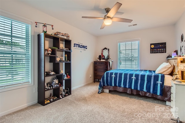 bedroom featuring carpet, a ceiling fan, and baseboards