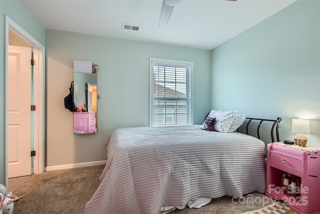 carpeted bedroom with baseboards and ceiling fan